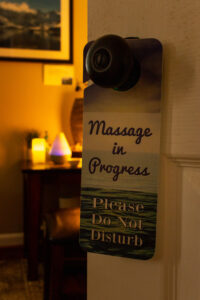 Massage in progress door hanger.