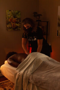 A woman getting a massage in a massage room.