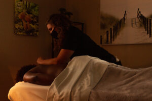 A woman getting a massage in a massage room.