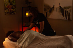 A woman getting a massage in a room.