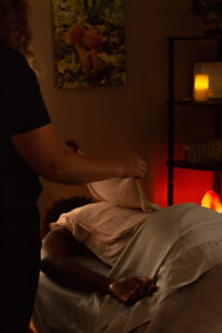 A woman is getting a massage in a room.