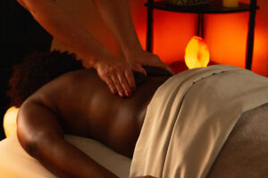 A woman getting a massage at a spa.